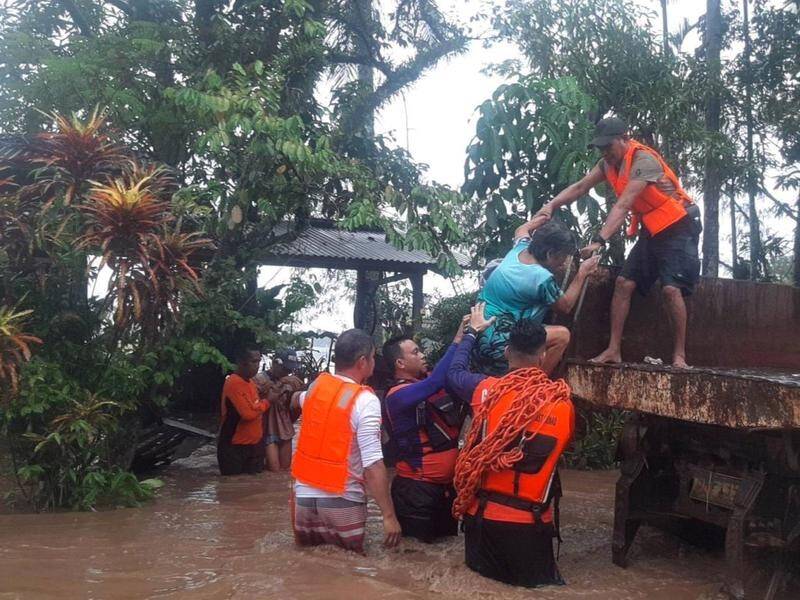 At least 25 people have been killed in floods and rain-induced landslides across the Philippines. (EPA PHOTO)