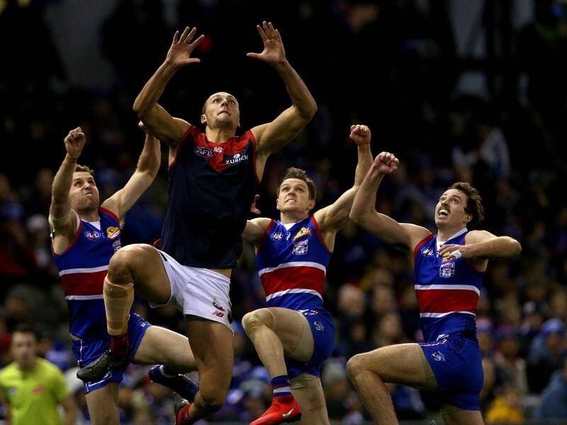 The Western Bulldogs have scored a hard-fought eight-point AFL win over Melbourne.