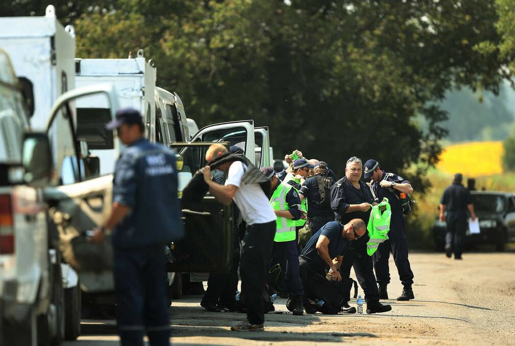 Australian Federal Police prepare to search the fields for human remains of passengers from the MH17 crash, on the outskirts of Rassypnoe village. Photo: Kate Geraghty