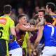 Lions' Dayne Zorko (L) gets into a scuffle during the AFL hammering by the Demons at the Gabba. (Jono Searle/AAP PHOTOS)