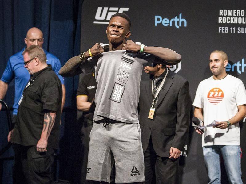 Rising MMA fighter Israel Adesanya (C) wants a trans-Tasman bout with Aussie champ Robert Whittaker.