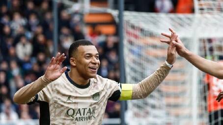 Kylian Mbappe celebrates after scoring PSG's second goal in their 4-1 win at Lorient. (EPA PHOTO)
