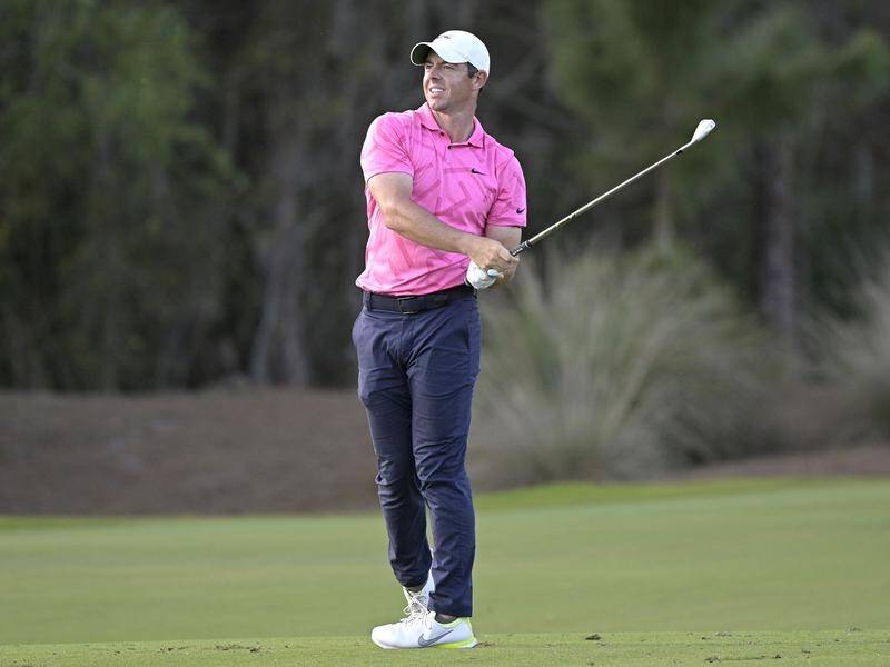 Rory McIlroy wore pink on Saturday but will don red on Sunday in honour of Tiger Woods.
