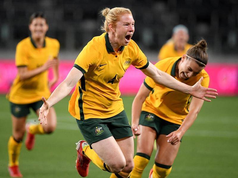 Clare Polkinghorne celebrates her opening goal for the Matildas but Brazil fought back to draw 2-2.