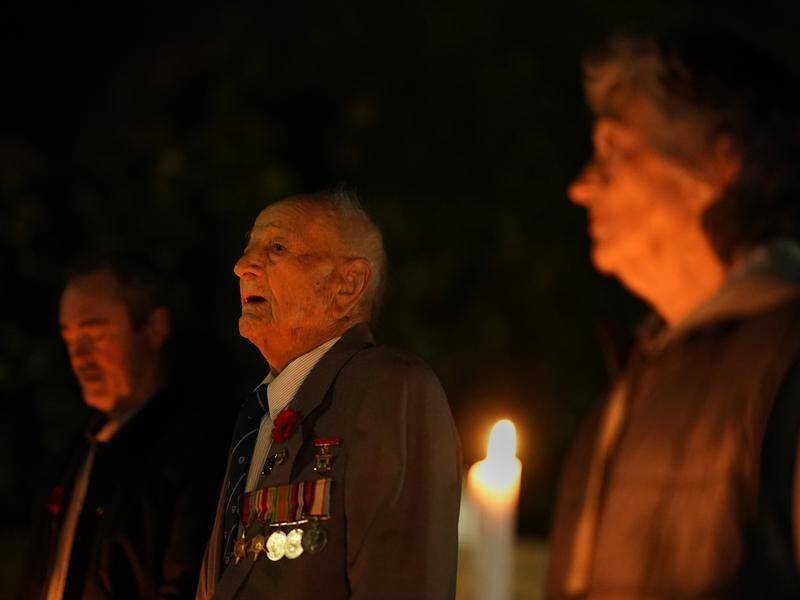 WWII veteran Jack Hair, 97, remembered his mates at a dawn service outside his Melbourne home.