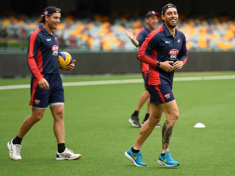 Players only managed to warm up before rain delayed proceedings at the GABBA.