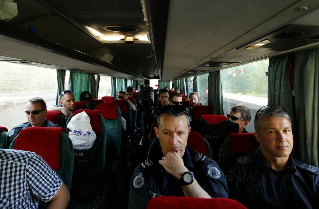Australian Federal Police officers on a bus about to depart Donetsk heading for Soledar village near Artemovk so that they can be based closer to the MH17 crash site. Photo: Kate Geraghty