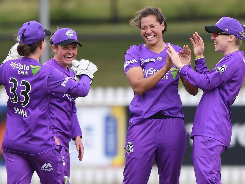 Belinda Vakarewa (centre) took 3-27 as the Hurricanes beat the Stars by 20 runs in the WBBL.