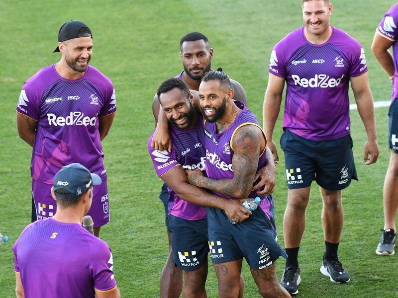 Melbourne's Josh Addo-Carr and Justin Olam share an embrace at a meet-and-greet with fans.
