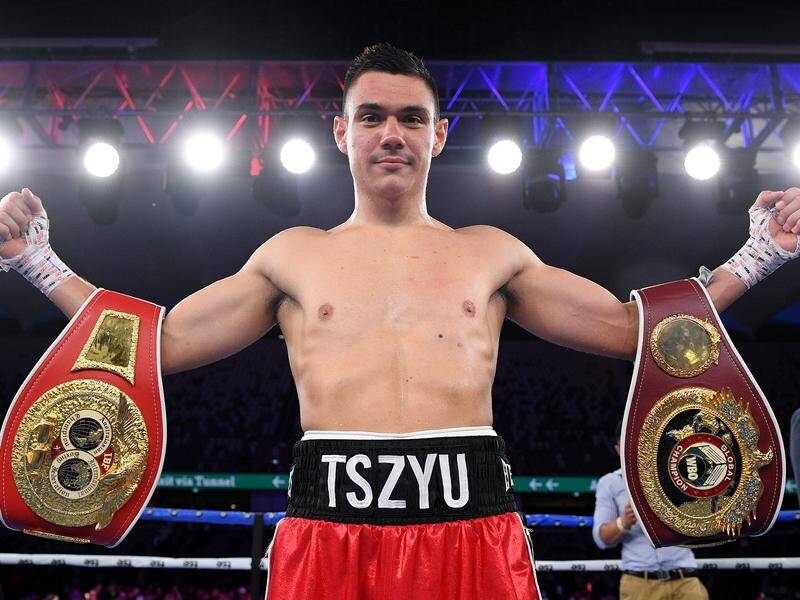 Tim Tszyu posing with his title belts after his swift knock-out of Bowyn Morgan.
