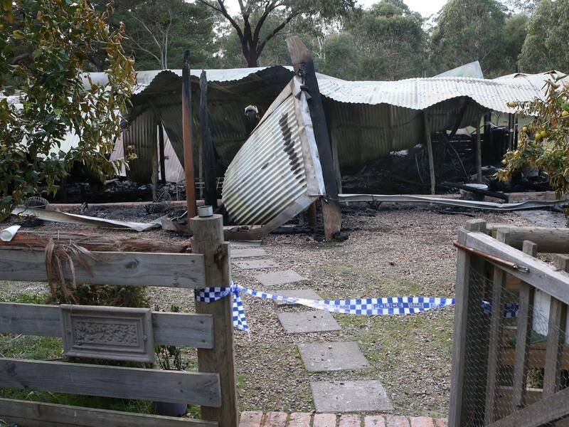 Two people died in a holiday house fire in regional Victoria.