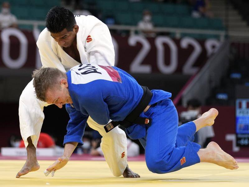 Australia's Nathan Katz (blue) won his Olympic judo opening bout but bowed out in the round of 16.