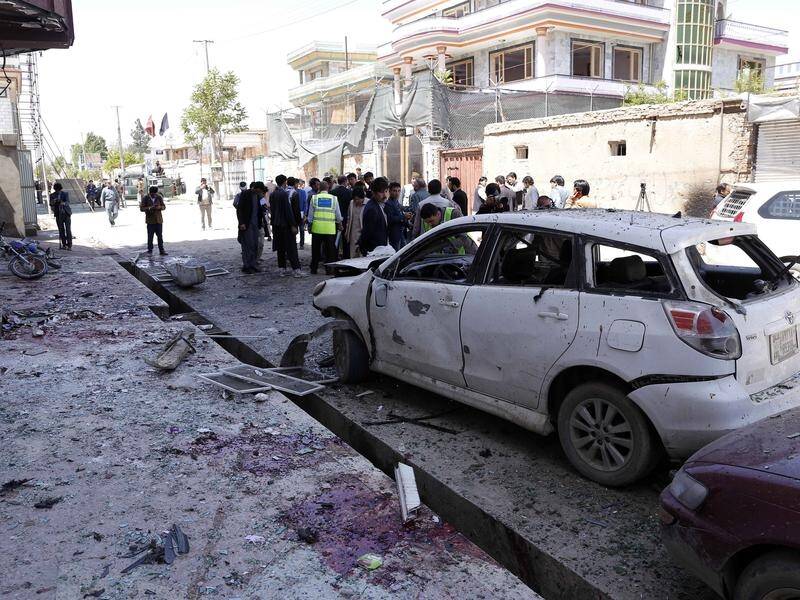 At least 57 people have been killed in a suicide bombing at an election centre in Kabul.