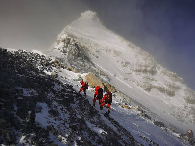 Members of a Chinese survey team head for the summit of Mount Everest.