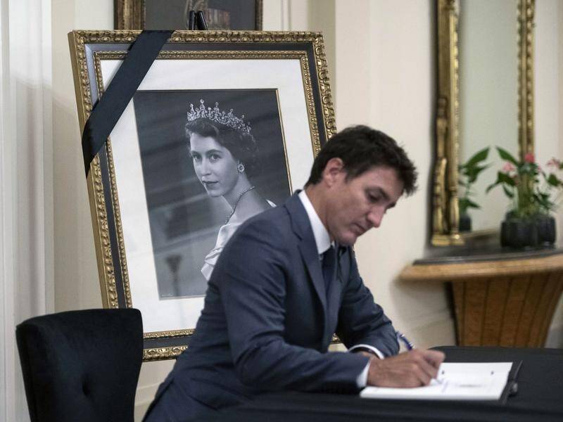 Canada PM Justin Trudeau says he is working with the provinces on a possible public holiday for all. (AP PHOTO)