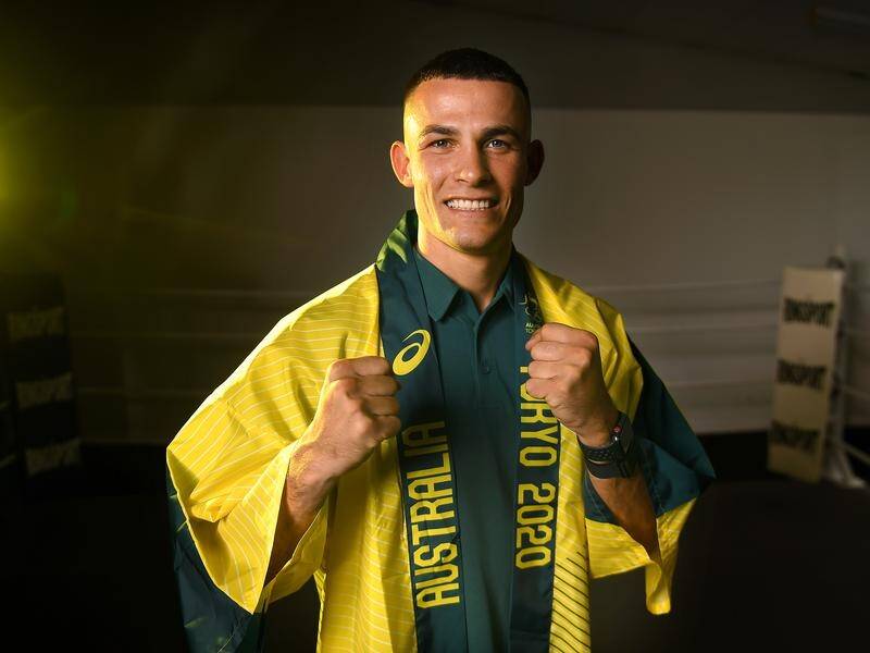 Australian boxer Harry Garside has won through to the Olympic lightweight division's quarter-finals.