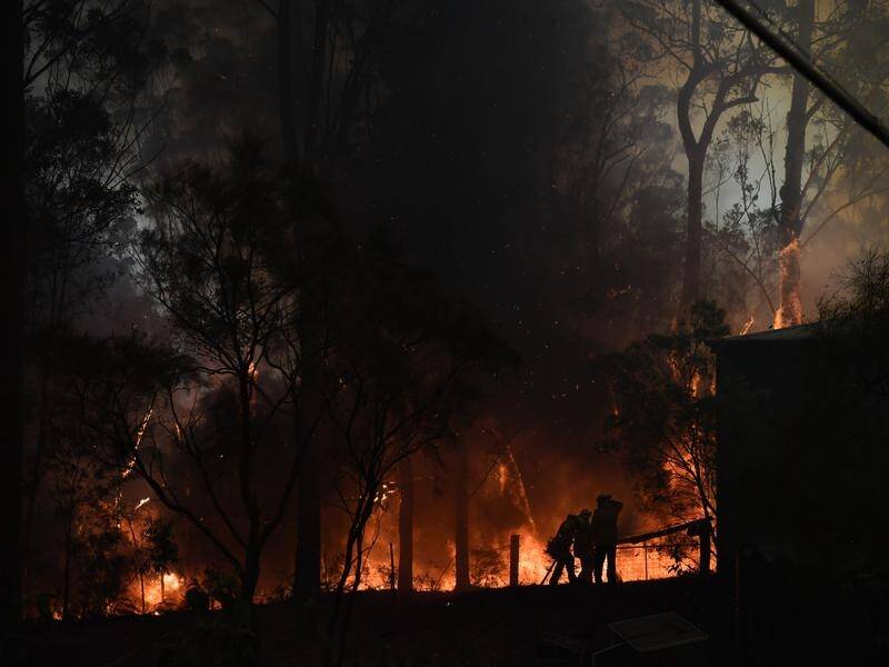 More than 65 bushfires continue to burn across NSW, with lightning strikes possibly starting others.