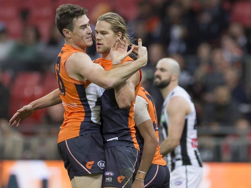 Jeremy Cameron (left) and Harry Himmelberg shared 10 goals as GWS trounced Collingwood in Sydney.