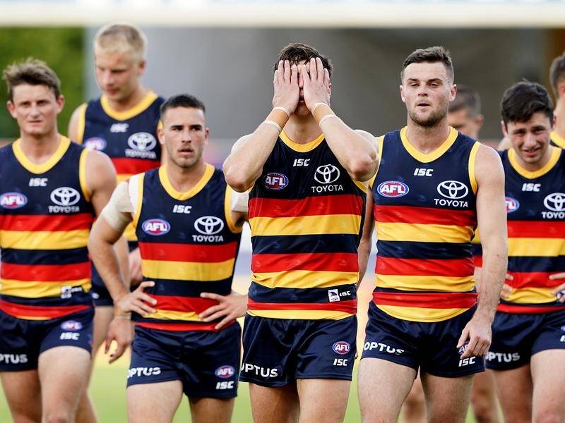 Crows players leave the field following a 20-point loss Fremantle, their fifth defeat of the season.