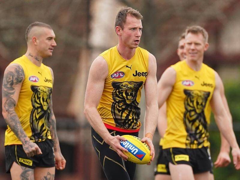 A second man has been charged over online threats against Richmond AFL defender Dylan Grimes.