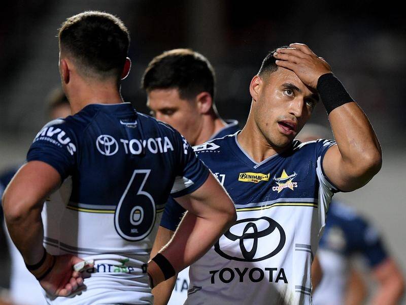 North Queensland's Valentine Holmes (r) has escaped sanction and is free to play in Origin II.