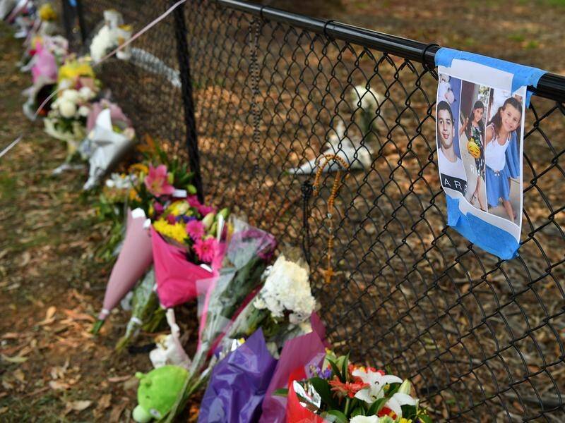 Flowers have been placed at the scene where four children were killed and three injured at Oatlands.