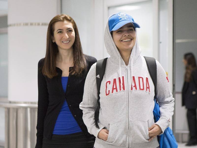 Rahaf Mohammed Alqunun (right) has found refuge in Canada after fleeing Saudi Arabia.
