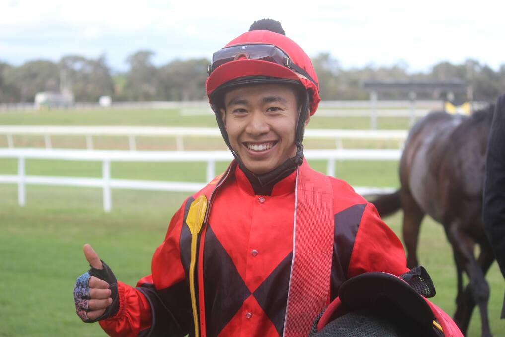 GRINNERS: Jockey Qin Yong had plenty of reasons to smile after riding Kentucky Flyer to victory in the 2018 Jungle Juice Cup. Picture: Stephen Bisset