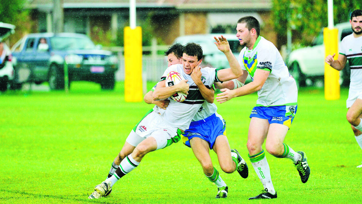 COLLARED:  East Maitland’s Brad Nicholls is tackled by a Stroud opponent during the Griffins 54-4 win.