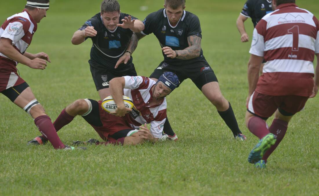 BLACKS VICTORIOUS: Action from Saturday's rugby union clash between Maitland Blacks and University.