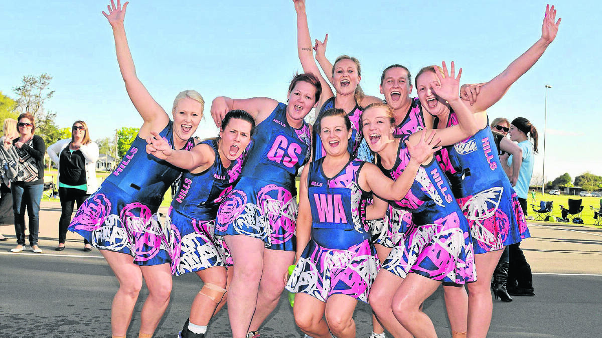 Hills Solicitors players (from left) Elli Bevan, Tara Pluck, Mel Morris, Michelle Cairns, Britney Robinson, Katie Lawrence, Susan Stokes and Katherine Zohrab celebrate their grand final victory against Lantry Plumbing.