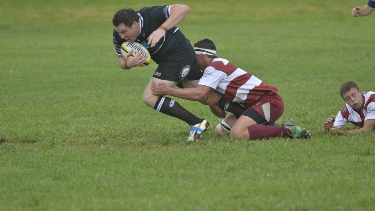 BLACKS VICTORIOUS: Action from Saturday's rugby union clash between Maitland Blacks and University.