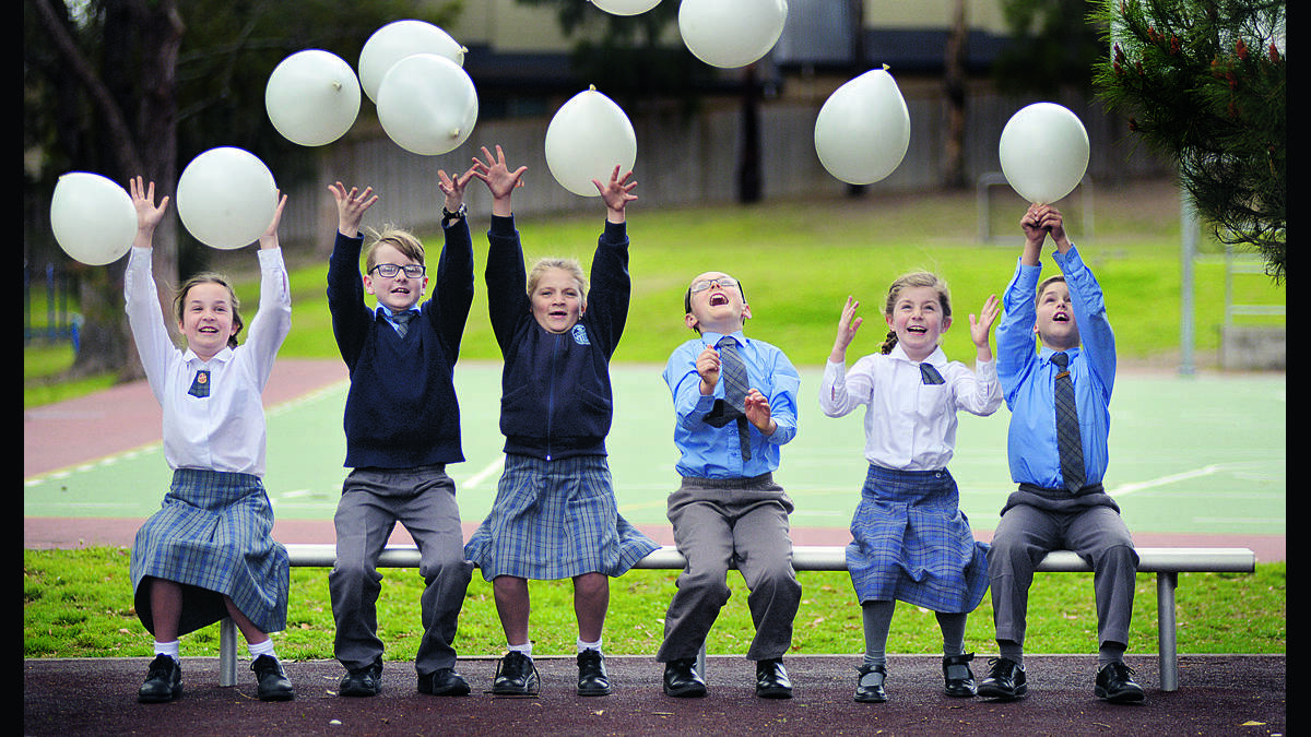 IMPORTANT MESSAGE:  St Joseph’s Primary School students Ava Lynch, Amitt Roberts, Olivia Kiem, Cameron Hogan, Lila Skinner and Thomas Dillon launch the school’s White Balloon Day campaign.  