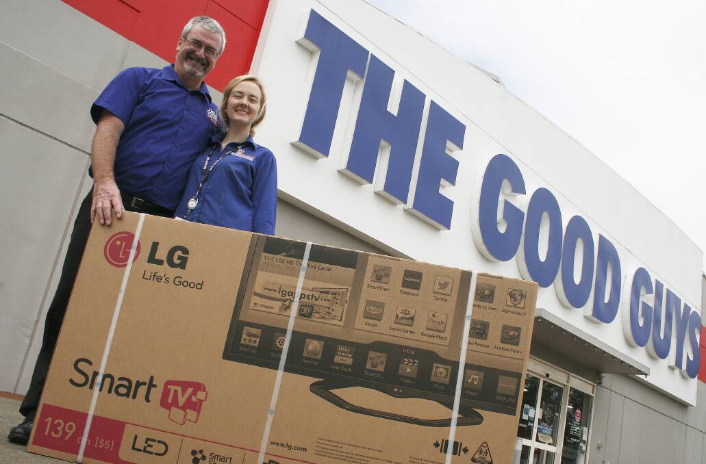 HUGHES FOUNDATION SUPPORT:  Brad Sangster and Acacia Fairweather from the The Good Guys with the LG 55-inch television they have donated for auction on the Mercury website.  