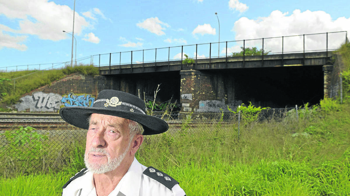 HIGH AND ALMOST DRY: Danny Lewis was trapped on the railway overpass in the 1955 flood for the best part of two weeks.  