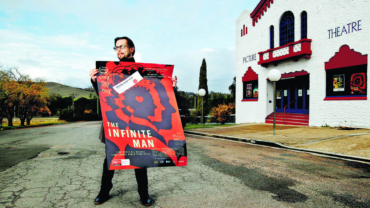 AUSTRALIAN PREMIERE:  Dungog Festival director Lex Lindsay with a poster for The Infinite Man, which will screen on Friday night at The James Theatre.  