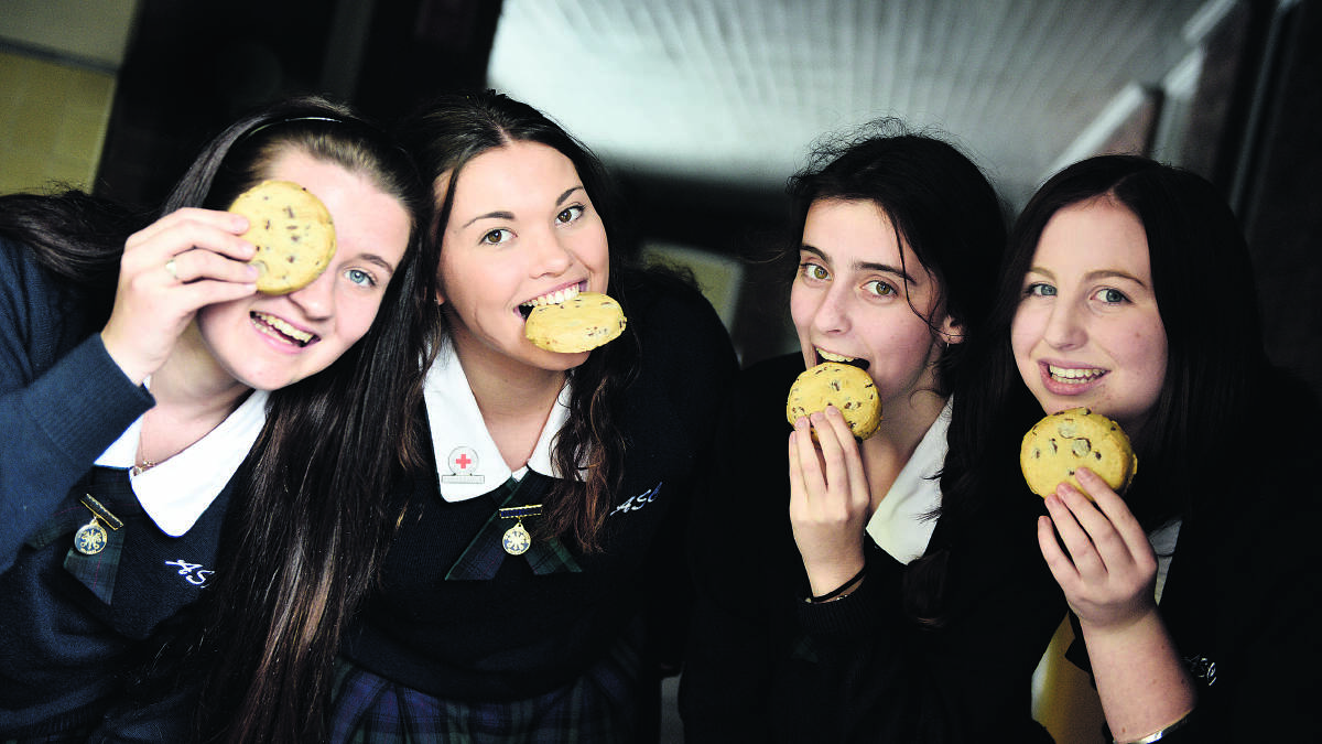 TAKING A BITE FOR A GOOD CAUSE:  All Saints College St Mary’s students Hannah Ogilvie, Vinette de Klerk, Bonita Maher and Jessica Mounser.
	  Picture by CATH BOWEN 