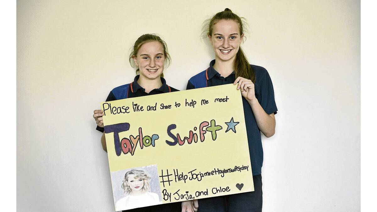 TAYLOR SWIFT FANS:  Twins Jorja and Chloe Hope.  Picture by  PERRY DUFFIN 