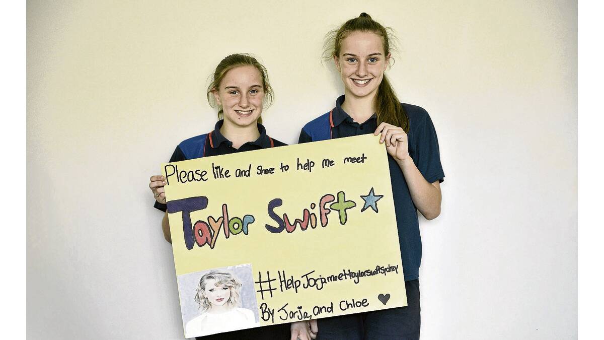TAYLOR SWIFT FANS:  Twins Jorja and Chloe Hope.  Picture by  PERRY DUFFIN 