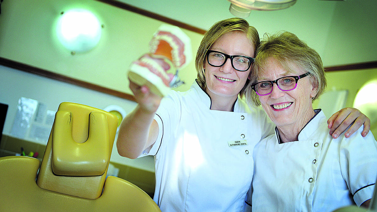 in mum’s footsteps:  Genevieve and Louise Nawrot, who work as dentists in Maitland.  	Picture by CATH BOWEN