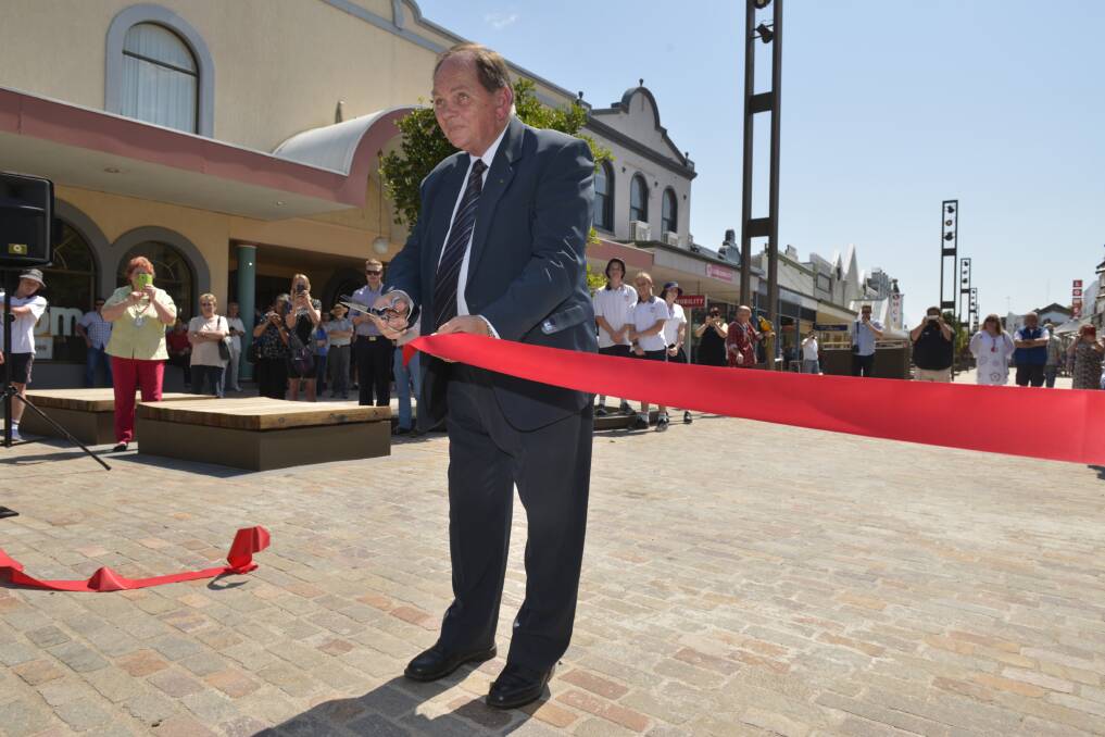 OPEN: Mayor Peter Blackmore cuts the ribbon at the opening of stage one of The Levee in October 2015.