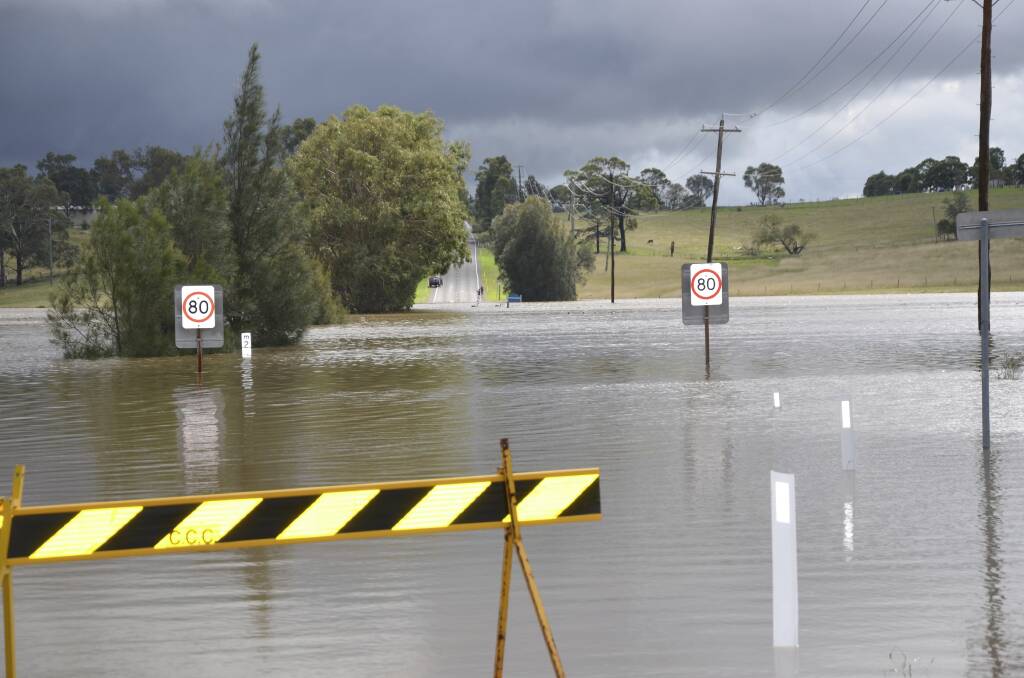 Cessnock Road at Testers Hollow was flooded after the superstorm hit the Hunter Region in April. With the road also flooded at Fishery Creek, thousands of Gillieston Heights residents were isolated for a week.