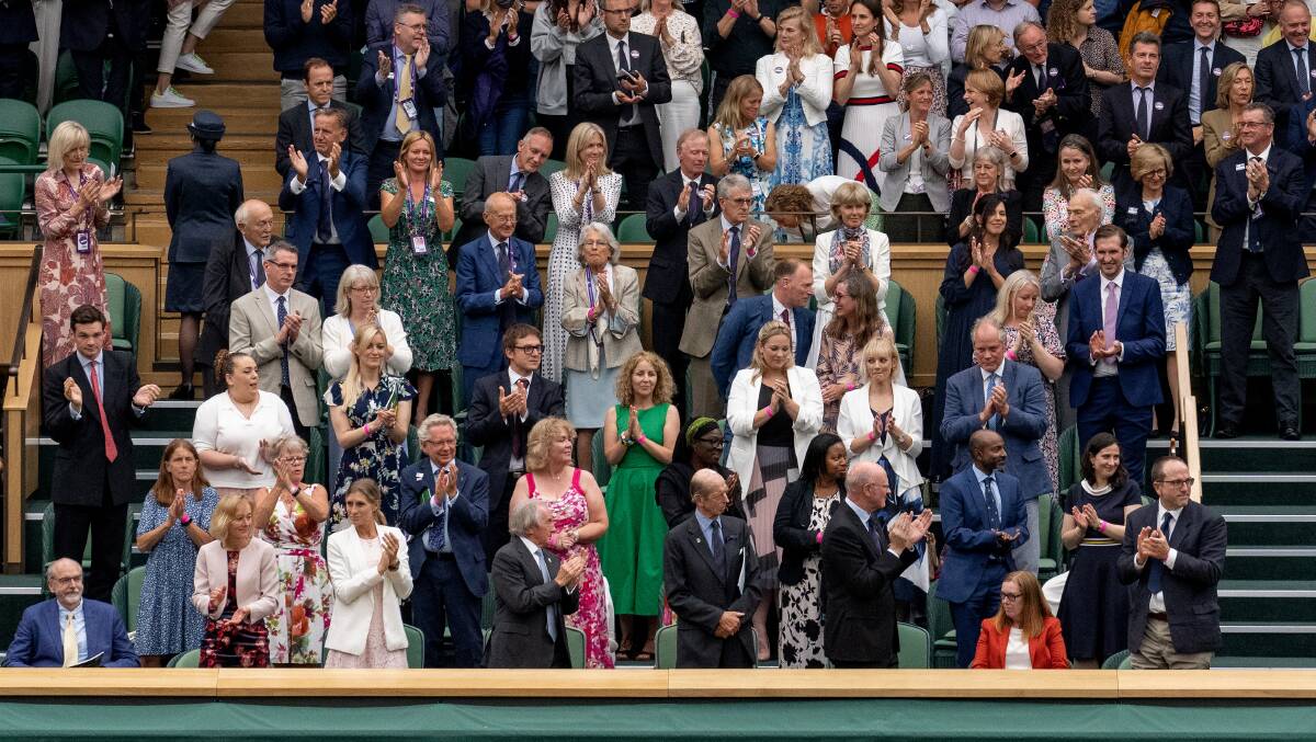 The Royal Box at Wimbledon stands and applauds the University of Oxford's Professor Sarah Gilbert (in red, bottom right). Picture: Getty Images