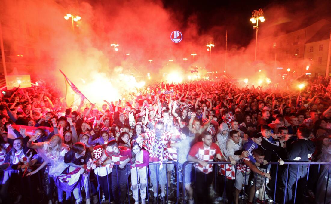 Croatian fans cheer while watching the semifinal match in Zagreb. Picture: AP