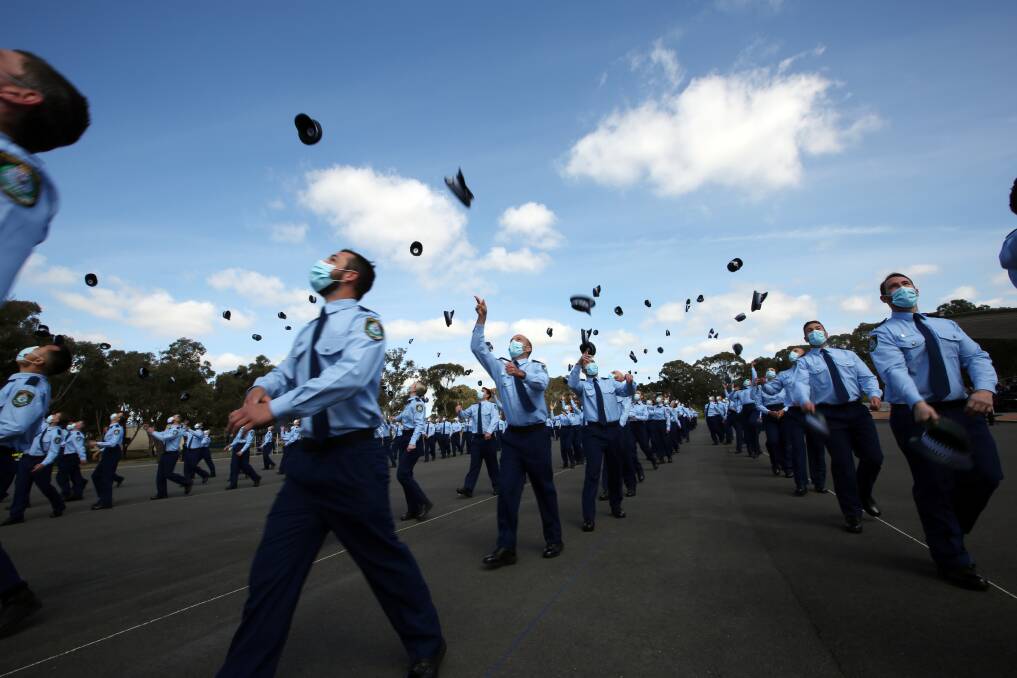 Beginnings: NSW Police graduates celebrate on Friday. 