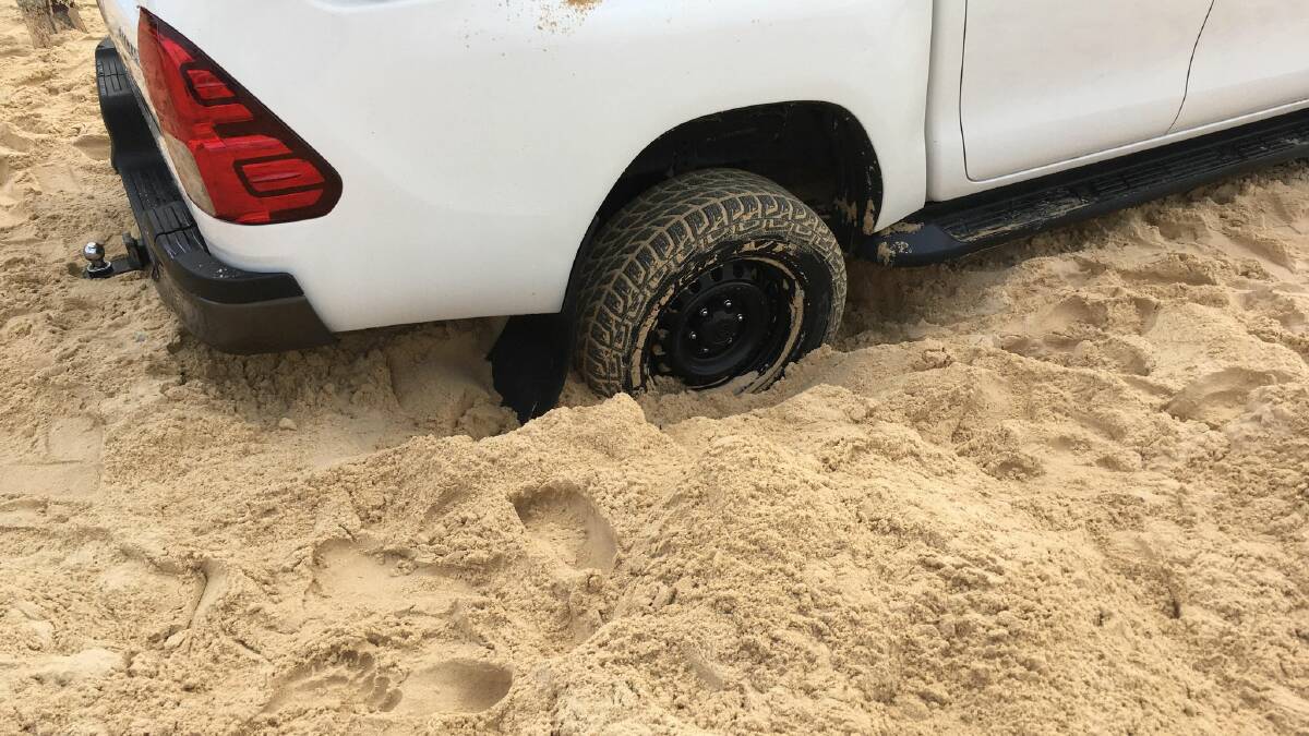 Bogged on beach because vehicle wasn't 4WD
