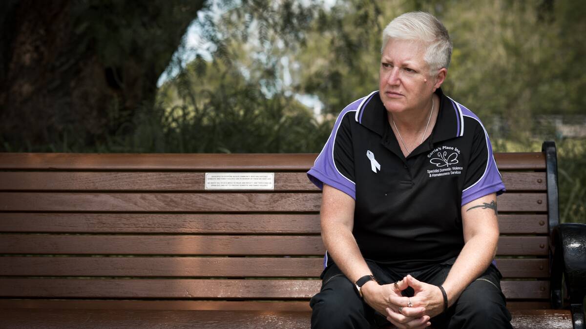 FRUSTRATED: Carrie's Place CEO Jan McDonald sits on the newly unveiled reflection bench for victims of domestic violence in Lorn. Picture: Perry Duffin