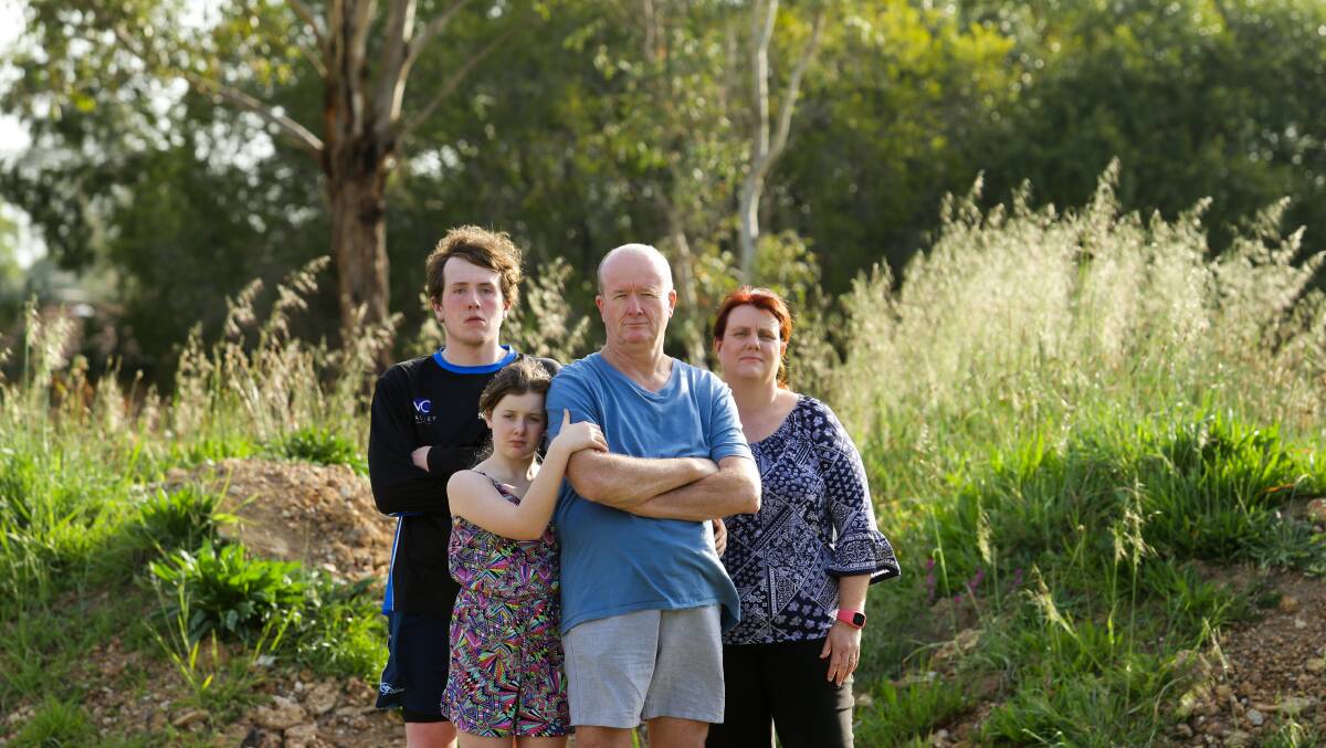 The Heald family at their Lochinvar block last week, where their home was ruined in the superstorm of April, 2015. It has not yet been rebuilt. Picture: Jonathan Carroll