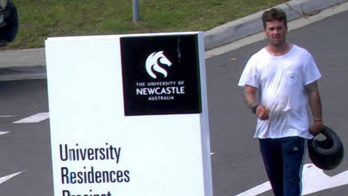 GUILTY: CCTV footage of Isaac Benjamin Jones wandering around the University of Newcastle Callaghan campus on March 24 this year. On Friday, Jones was jailed for a maximum of two years for the gunpoint carjacking of a student.