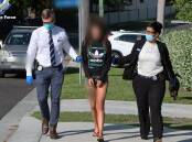 ASSISTED: Taylah McDonald is arrested at West Wallsend last year. Picture: NSW Police 